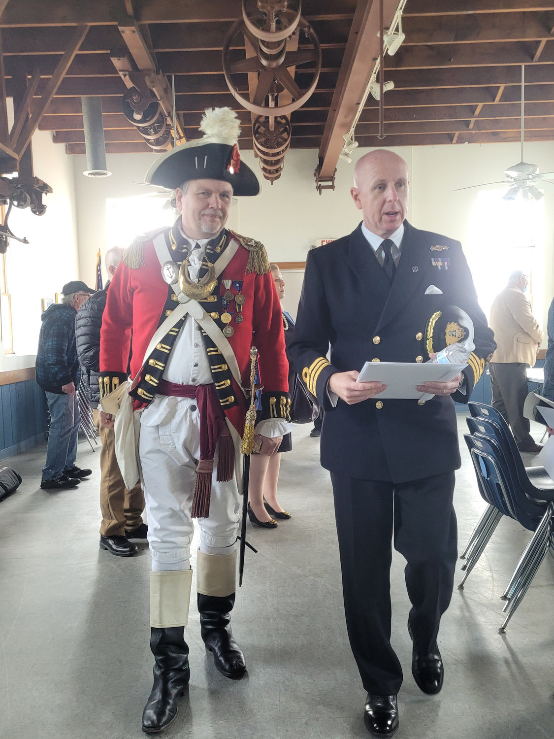TOP BRASS: Johnston resident Col. Ron Barnes, Commander of the Pawtuxet Rangers, walks with British Naval Commander Steven White, of Her Majesty’s Royal Navy.
